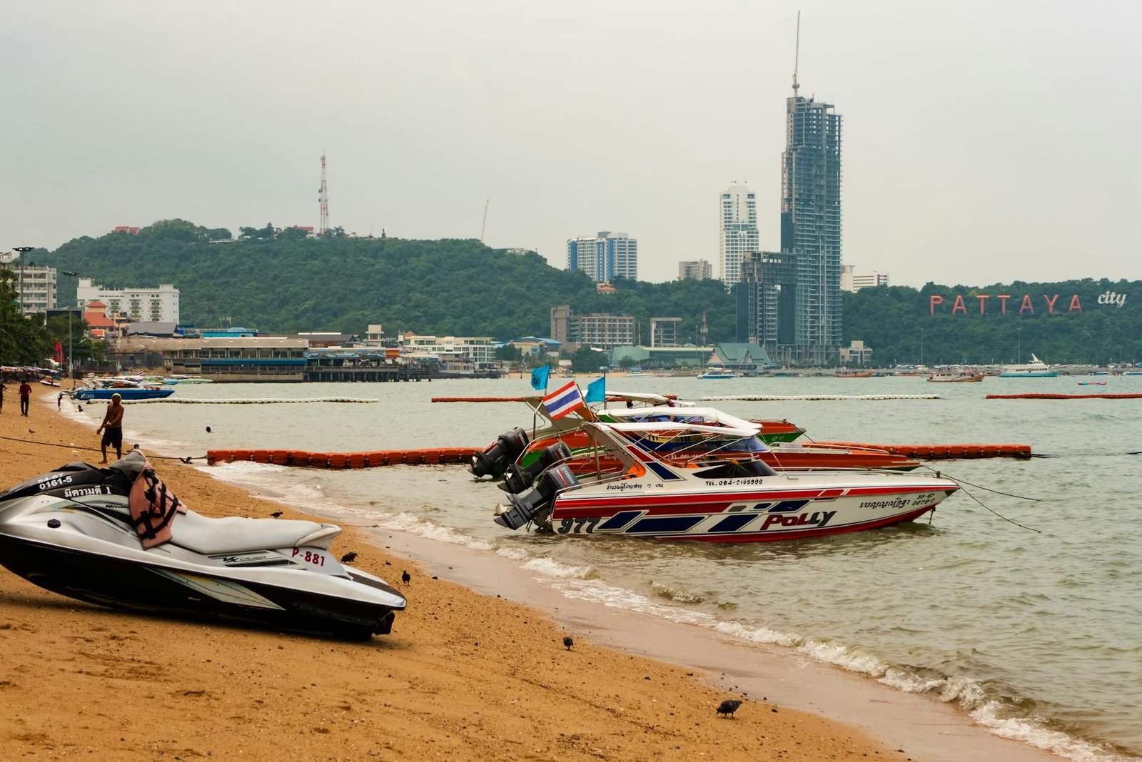a boat by the beach in pattaya