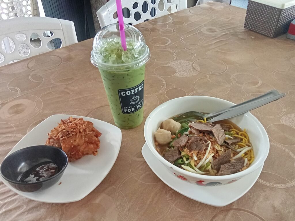 Noodle soup, a piece of fried chicken and a Matcha Latte