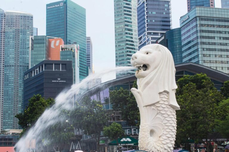 iconic merlion statue against singapore skyline