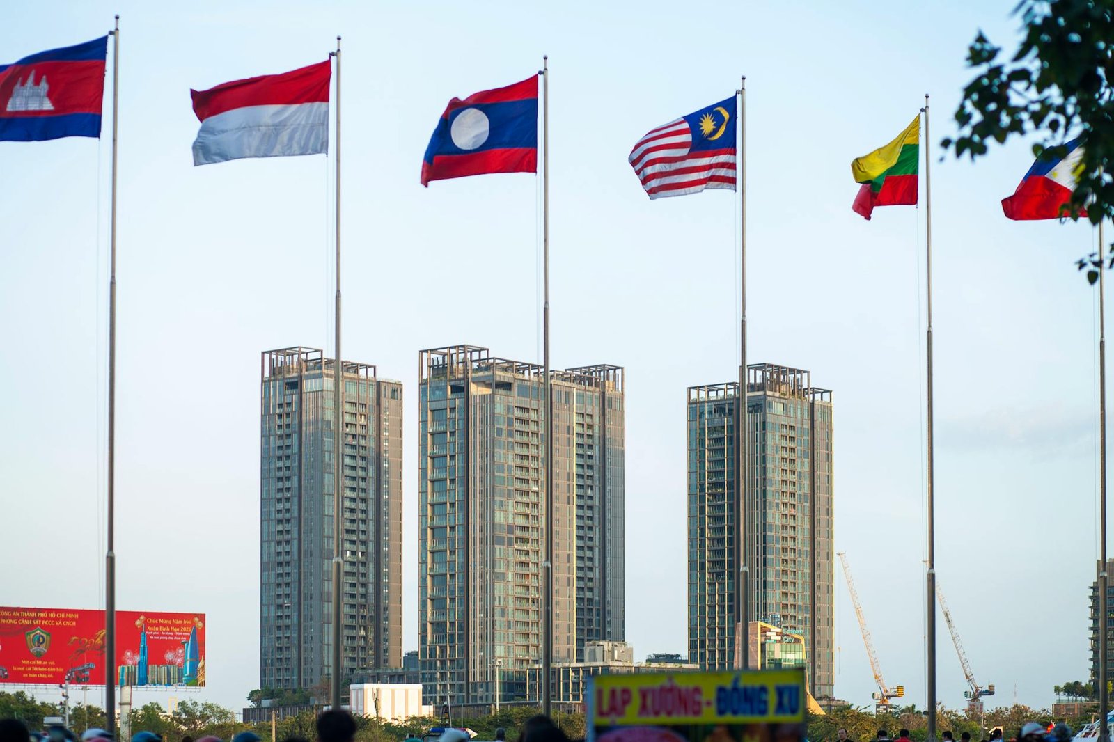 international flags with modern skyscrapers