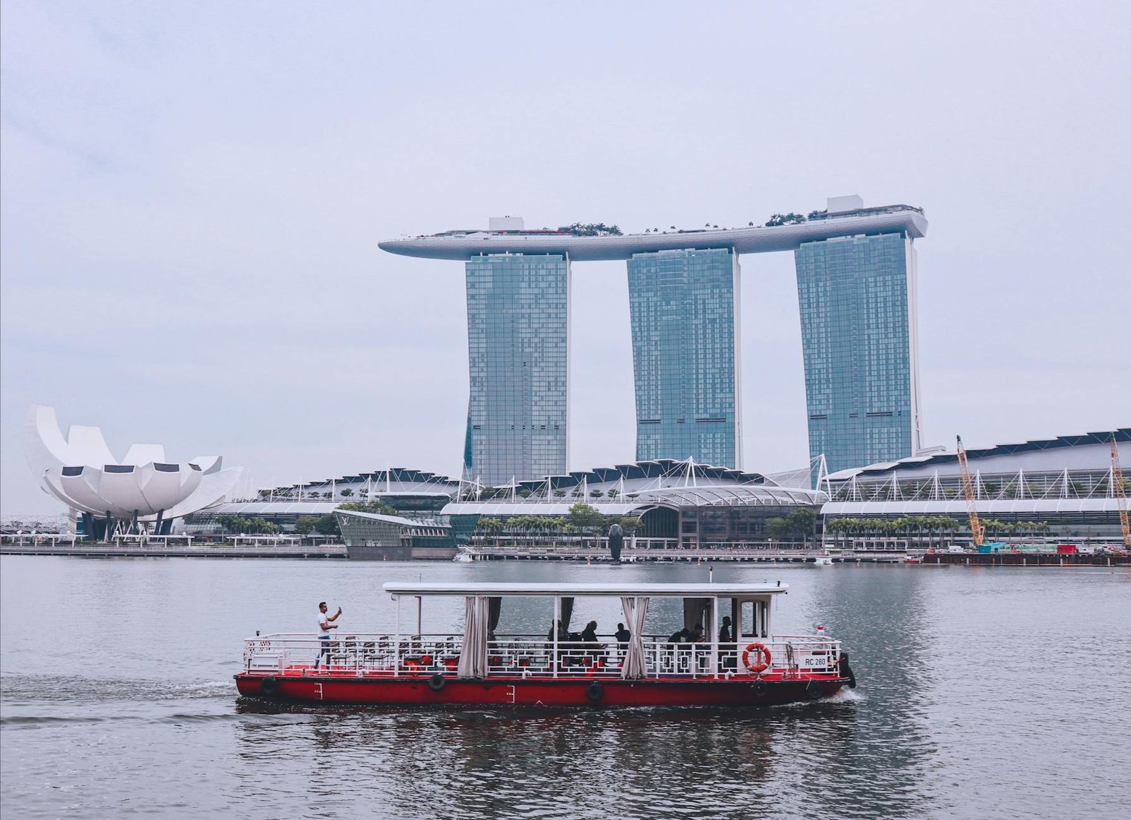 white and red boat in the water