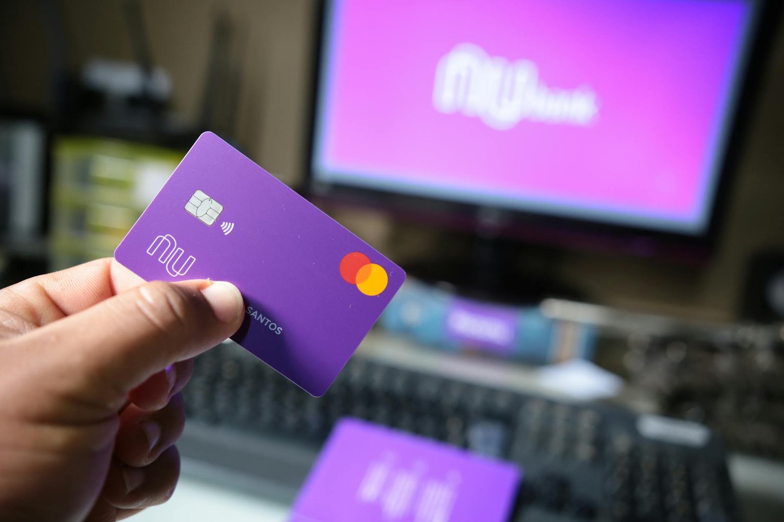 a person holding a bank card